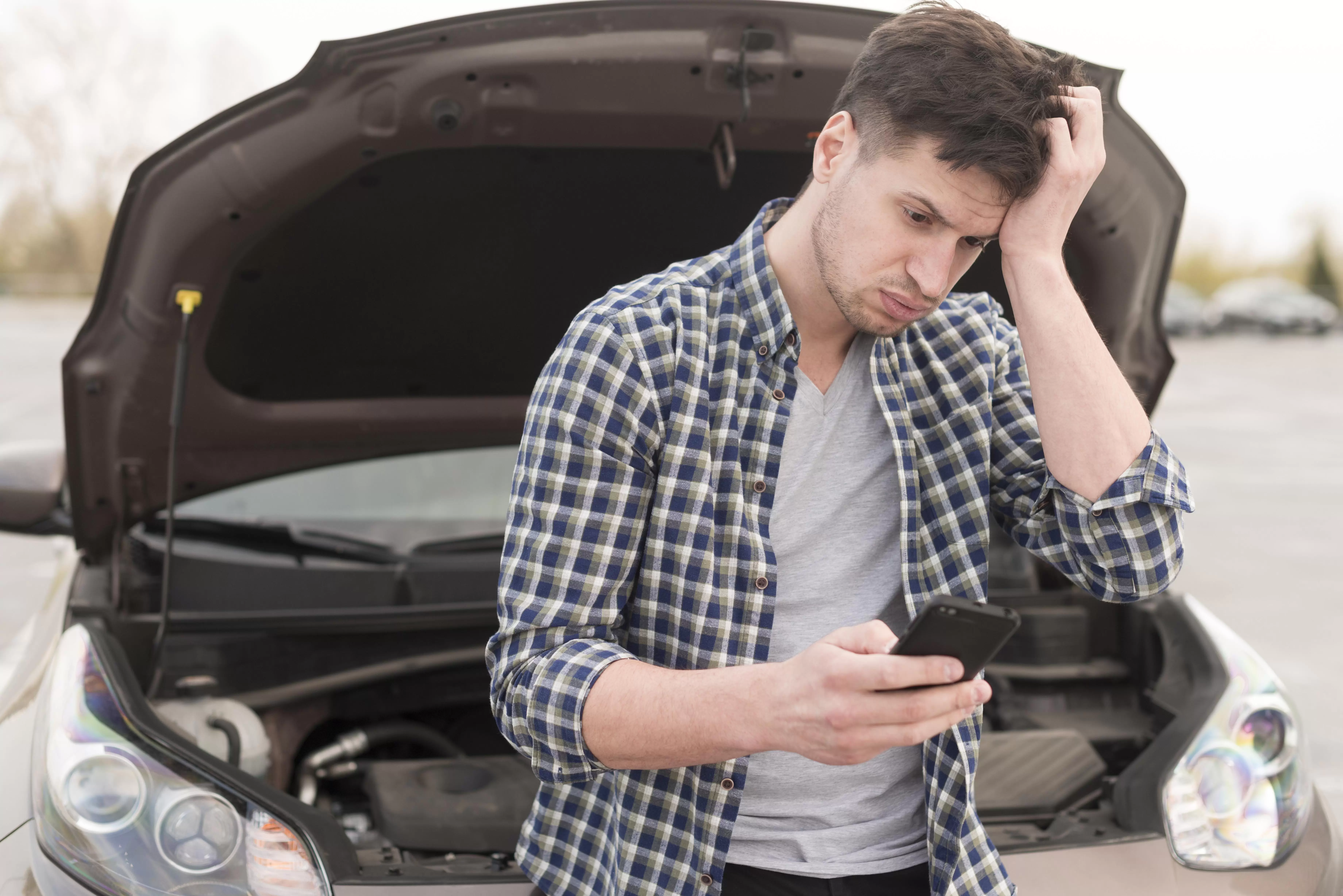 Man With Mobile Broken Car